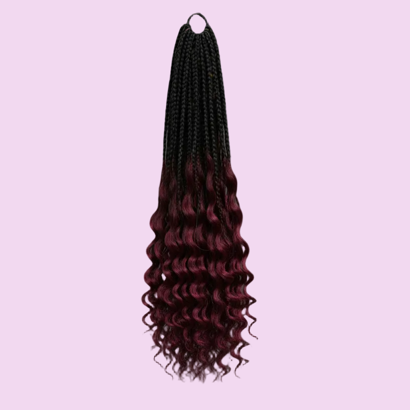 Braided hair extensions with black and red gradient on a gray background